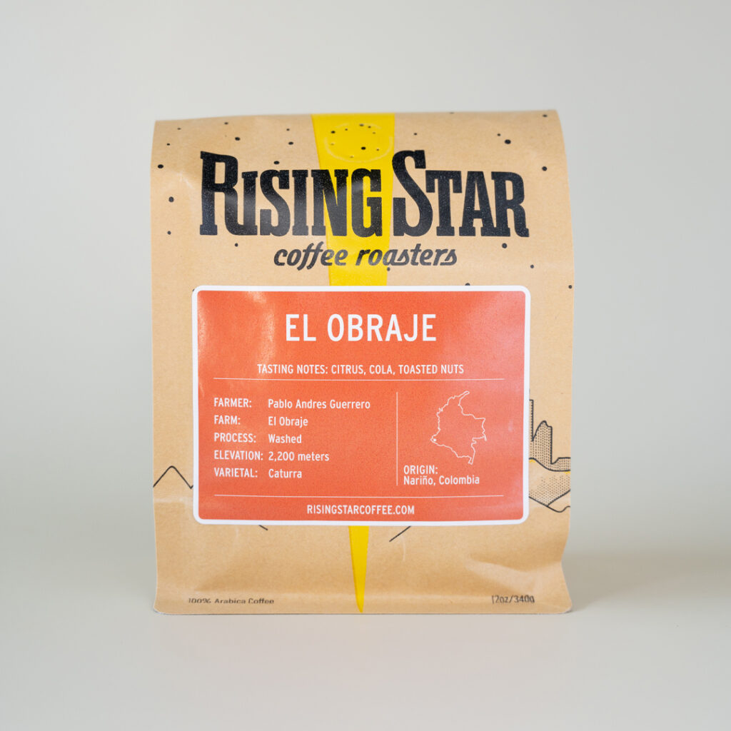 A bag of Rising Star Coffee. The orange label reads - 'El Obraje'. The origin is Nariño, Colombia.