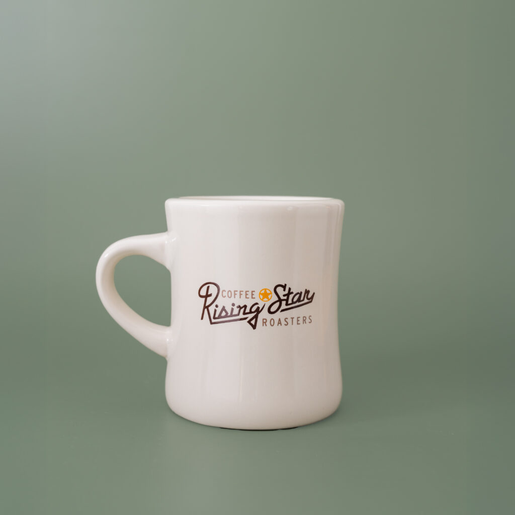 A ceramic diner mug with a script Rising Star logo