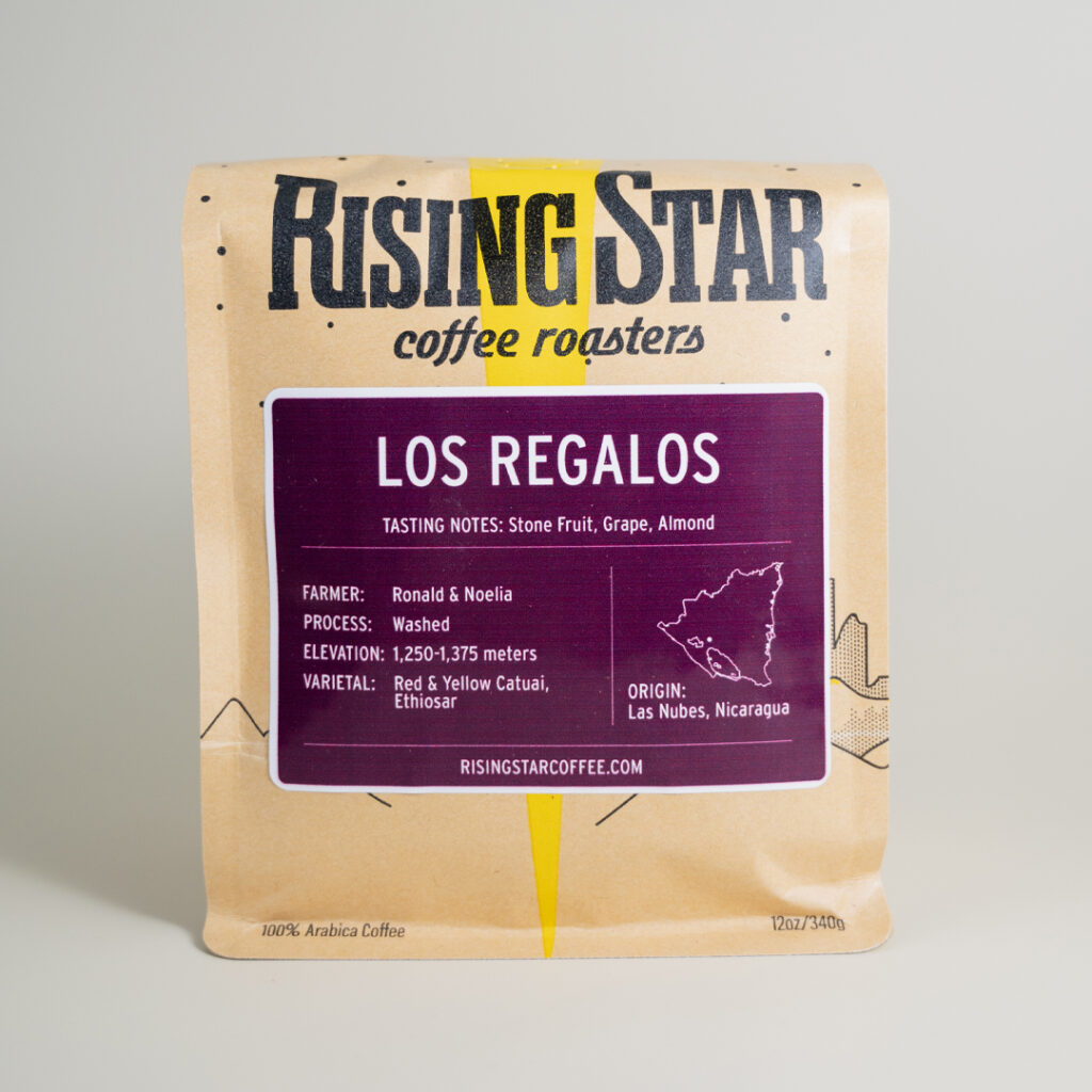 A bag of Rising Star Coffee with a purple label called Los Regalos. It is from Nicaragua.