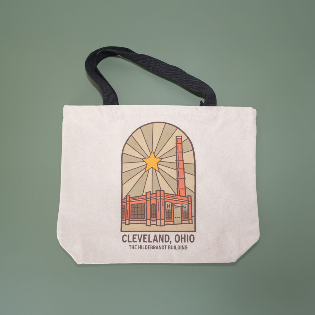 A canvas tote back with artwork that features the Hildebrant building, the home of Rising Star Coffees roasting facility.