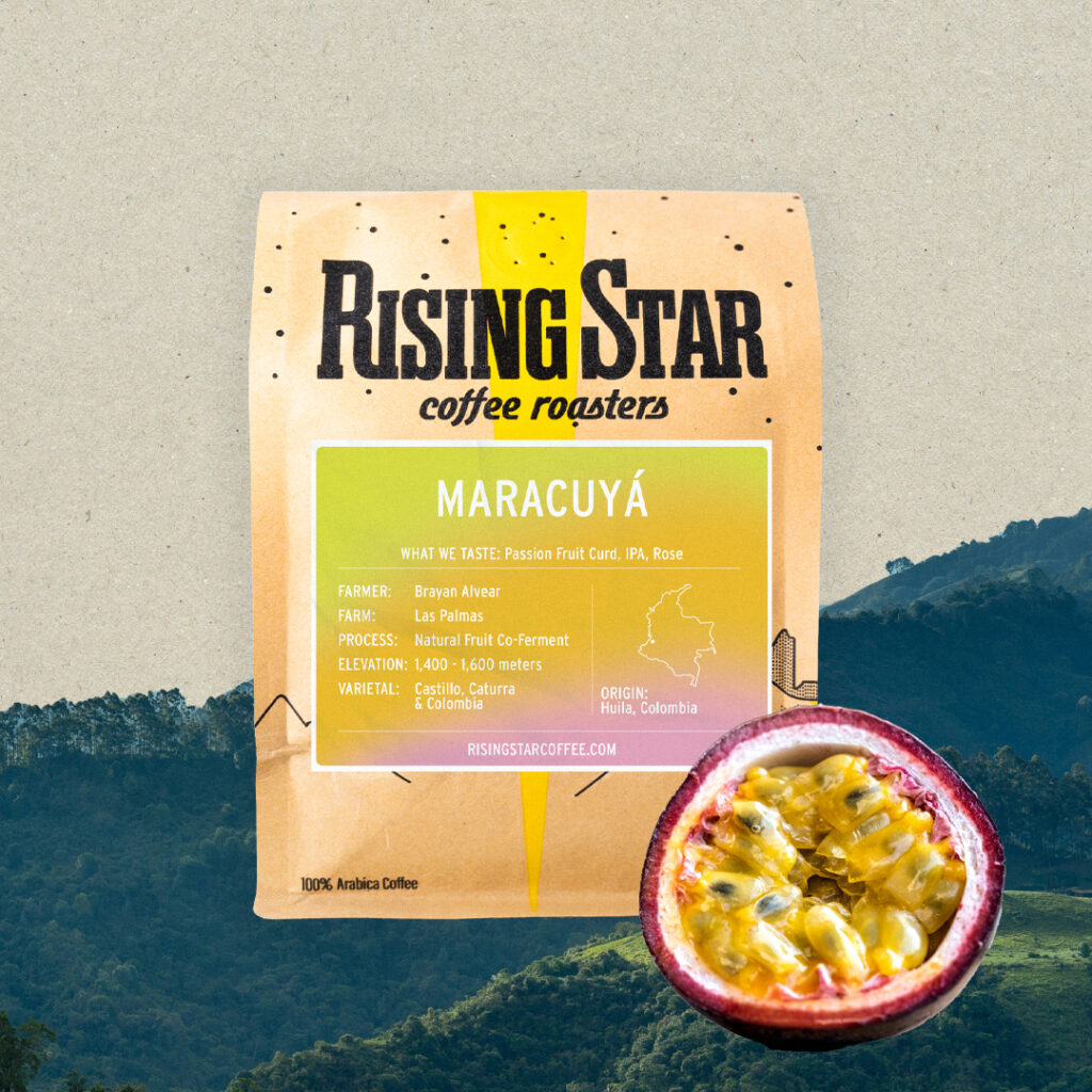 A bag of Rising Star's Maracuyá coffee. The bag has a cut in half passion fruit off set to the side of the bag.