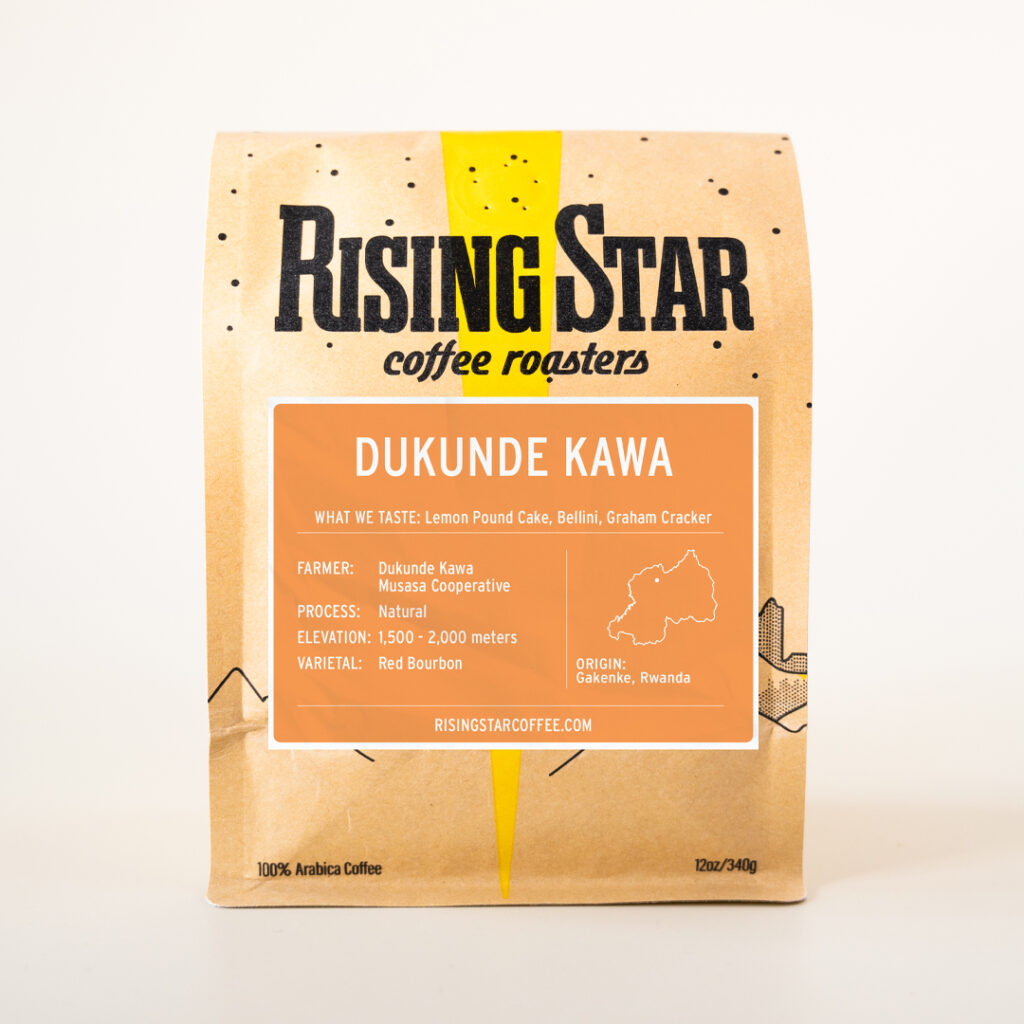 A bag of Rising Star Coffee named Dukunde Kawa from the Gakenke Region of Rwanda. The label is a bright peachy orange.