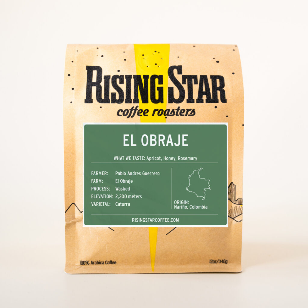 A bag of Rising Star Coffee with a sage green label that reads El Obraje - a coffee from Nariño, Colombia.